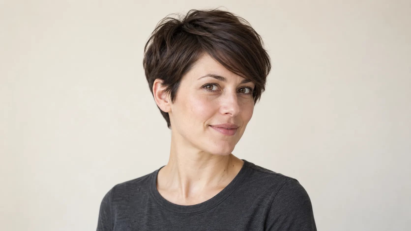 Illustrative soft pixie with a side-swept fringe and visible ear outline